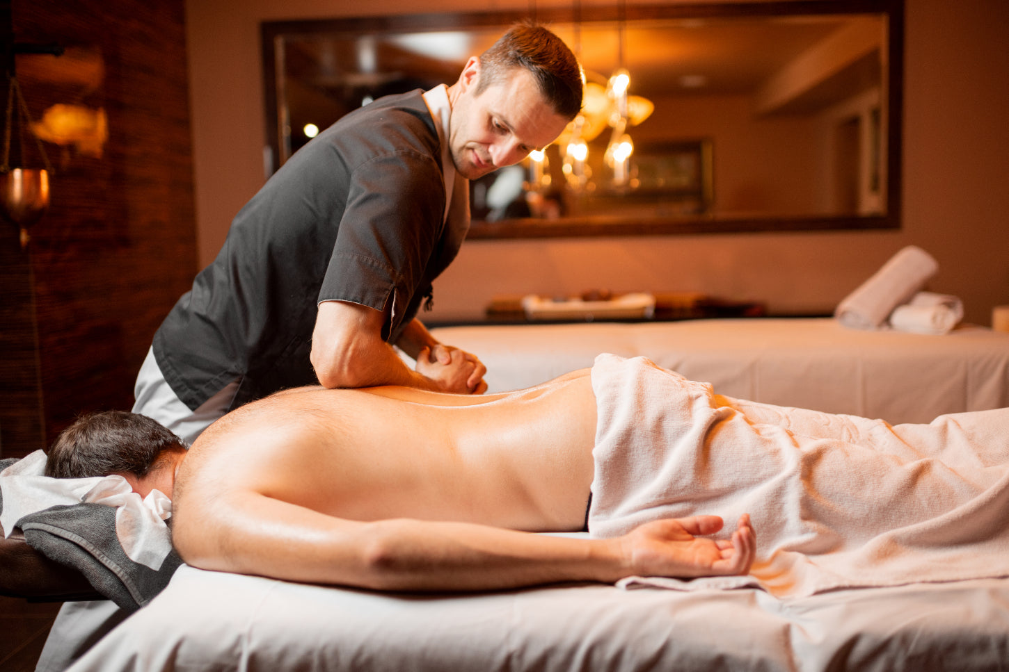 masseur doing a deep tissue massage