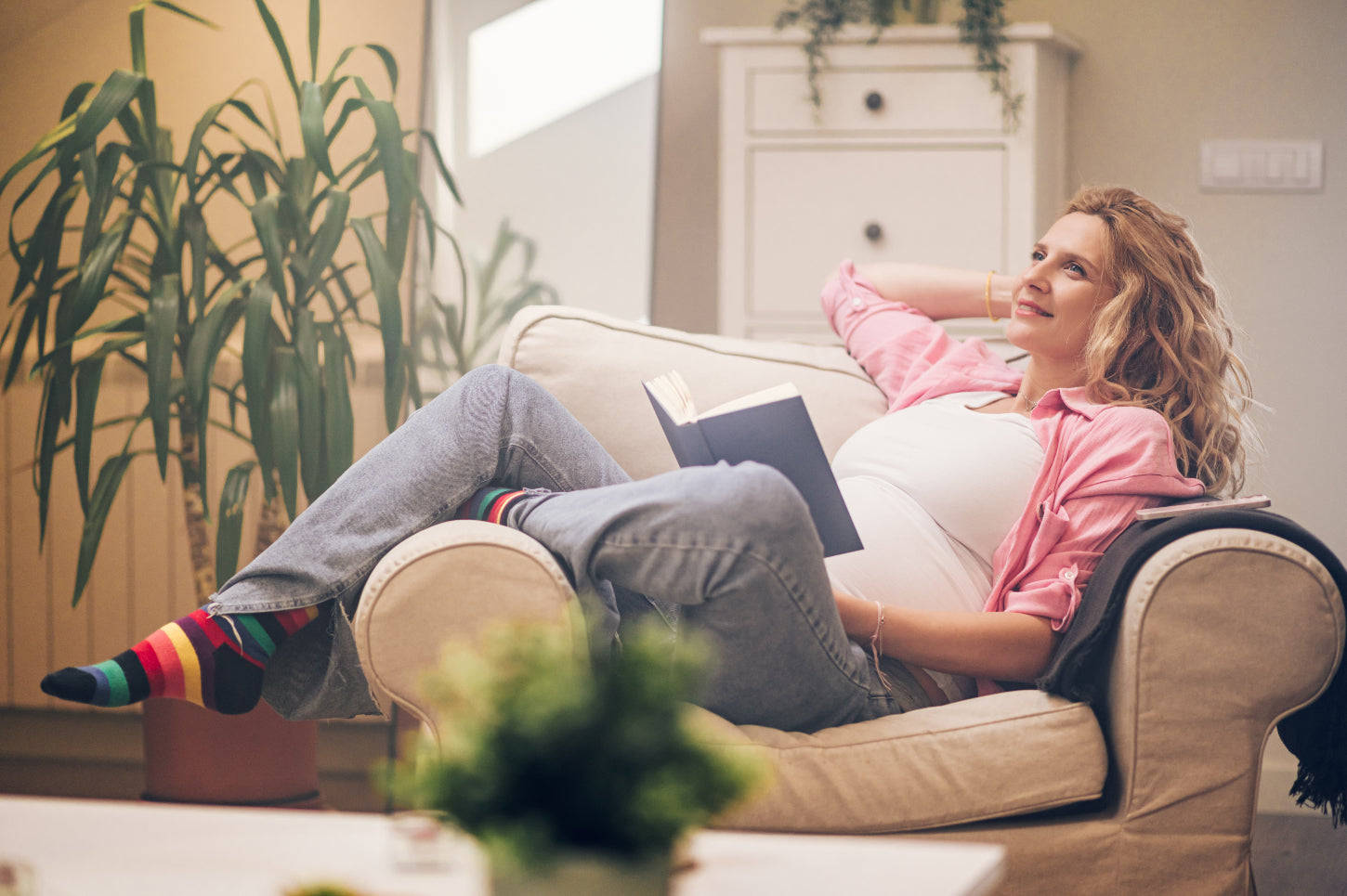 pregnant-woman-sitting-on-a-cozy-chair-relaxing