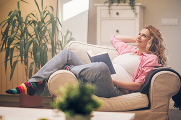 pregnant-woman-sitting-on-a-cozy-chair-relaxing