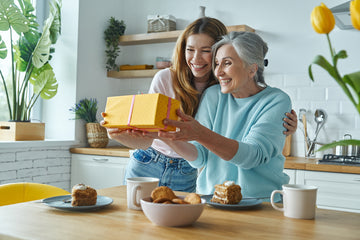 women exchanging mothers day gifts for grandma
