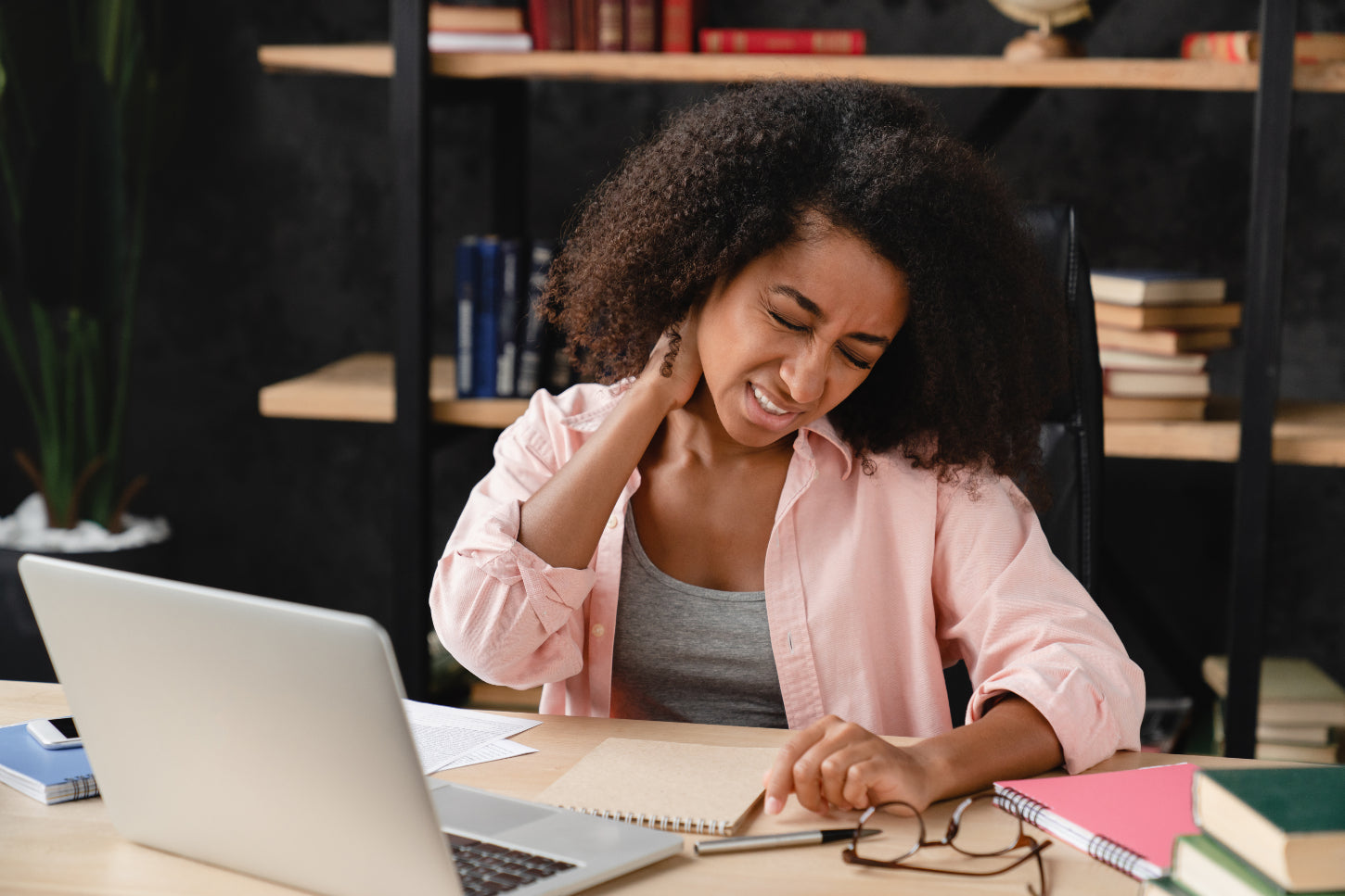 acute vs chronic neck pain in female sitting at desk