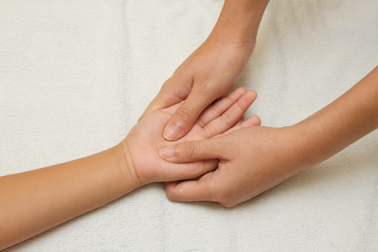 childrens massage techniques on hand