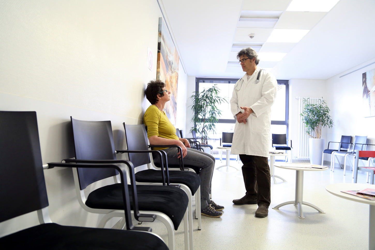 doctor and patient in decorated waiting room