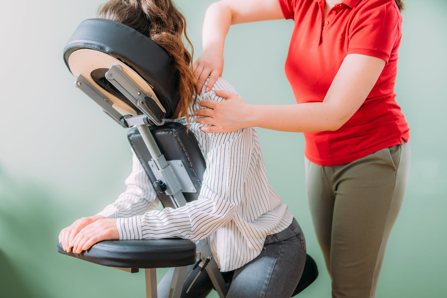female-getting-chair-massage-from-trained-massage-therapist