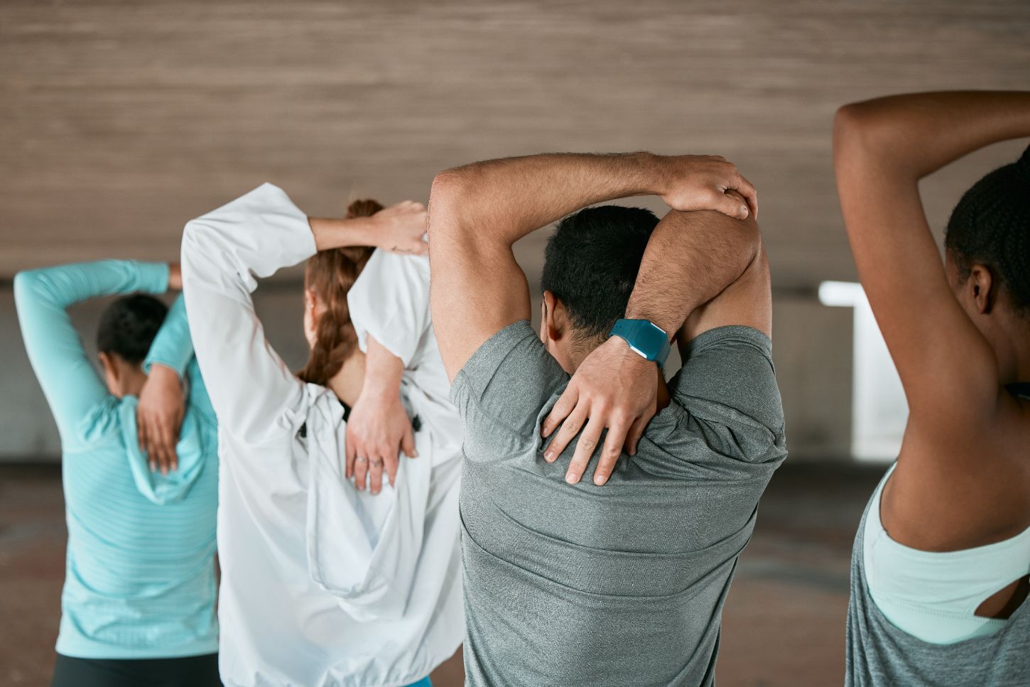 group doing shoulder blad stretches