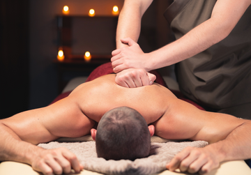 man getting a deep tissue vs sports massage