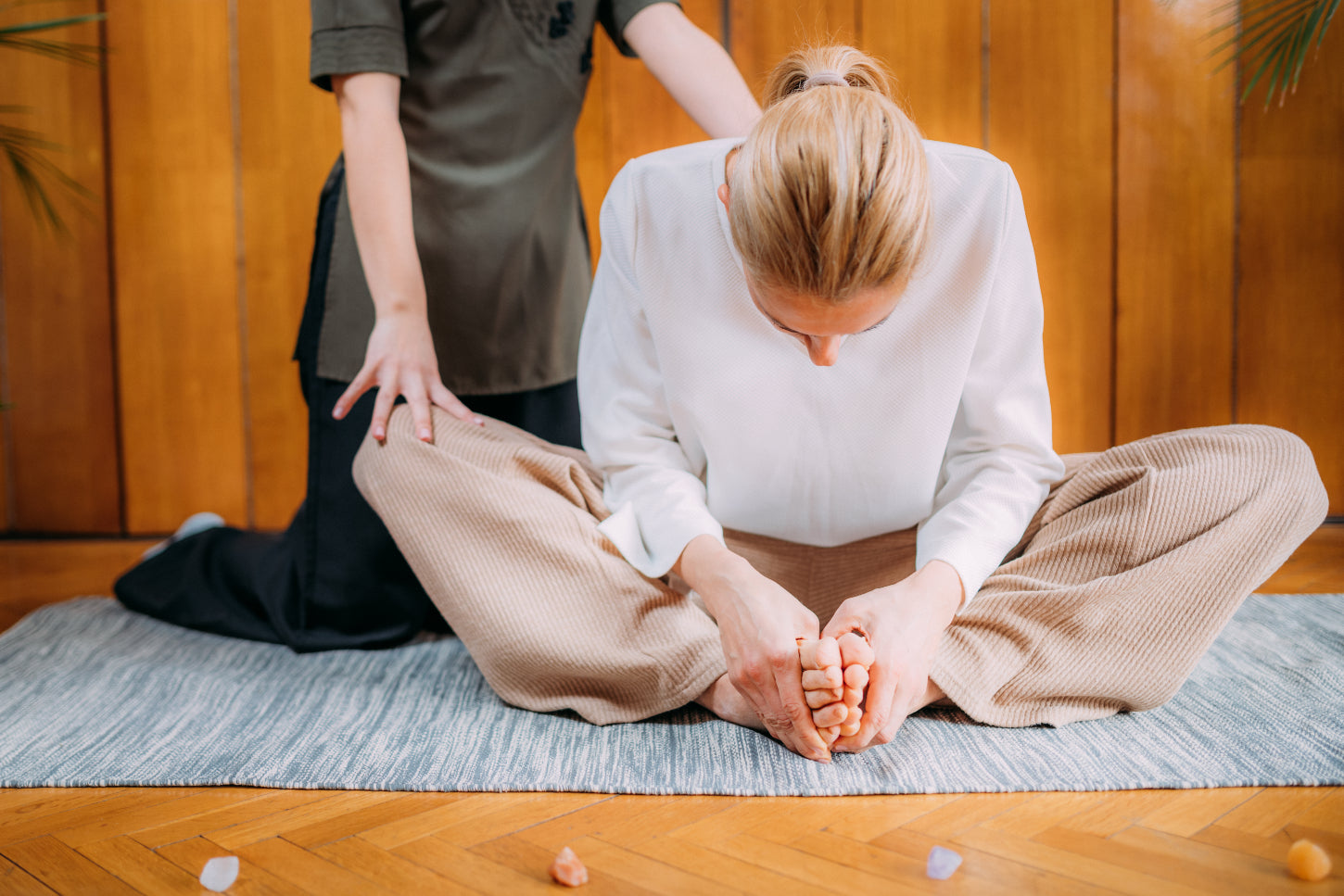 therapist uses massage and meditation to promote relaxation