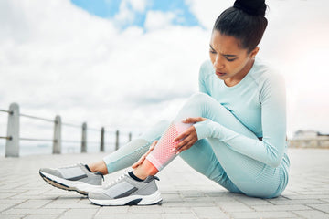 woman massaging her leg soreness